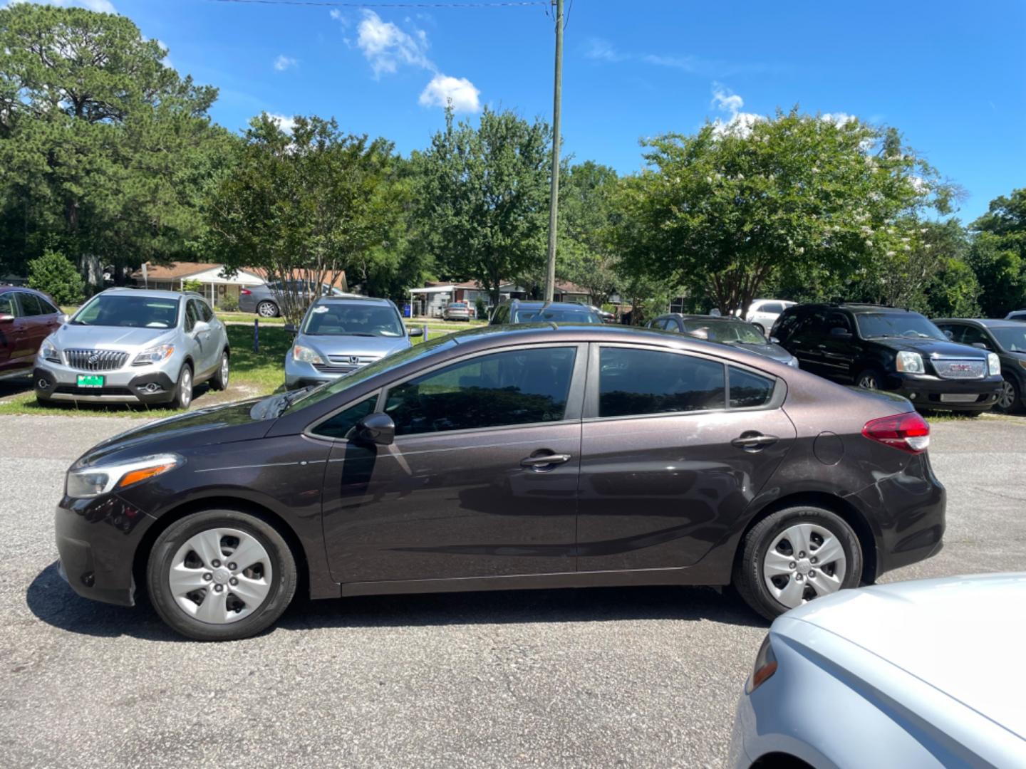 2017 BROWN KIA FORTE LX (3KPFK4A75HE) with an 2.0L engine, automatic transmission, located at 5103 Dorchester Rd., Charleston, SC, 29418-5607, (843) 767-1122, 36.245171, -115.228050 - Local Trade-in with clean interior, CD/AUX/USB/Sat, Hands-free Phone, Power Windows, Power Locks, Power Mirrors, Keyless Entry. 99k miles! Located at New Life Auto Sales! 2023 WINNER for Post & Courier's Charleston's Choice Pre-owned Car Dealer AND 2018-2024 Top 5 Finalist for Charleston City Paper - Photo#3